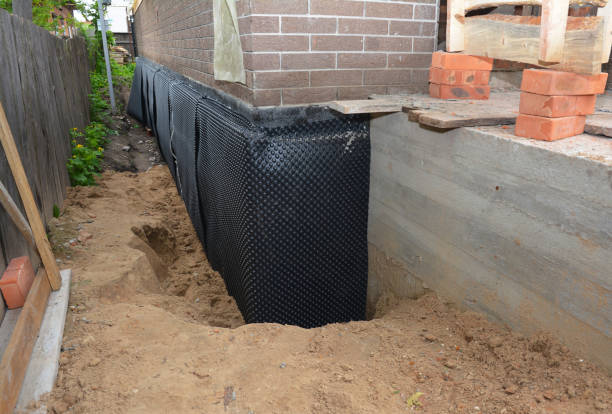 SJ Waterproofing Pros technician performing targeted Exterior Waterproofing assessment in North Manchester, IN